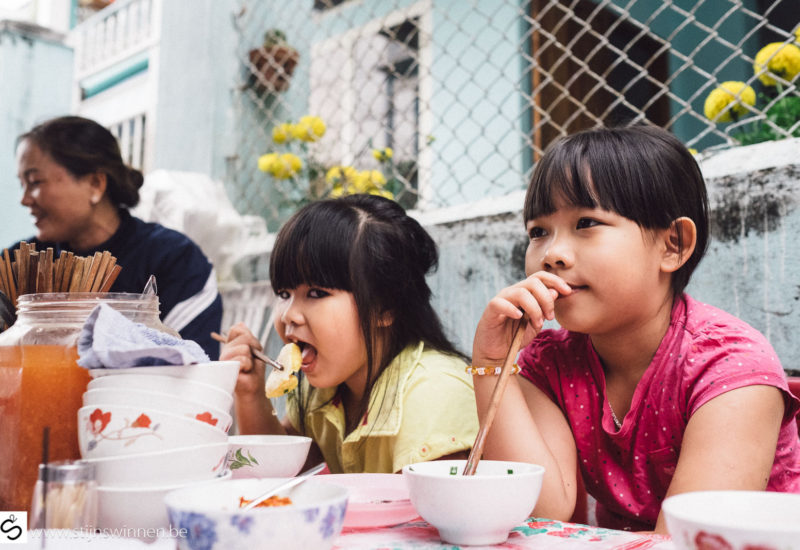 Kids having street food breakfast in Nha Trang